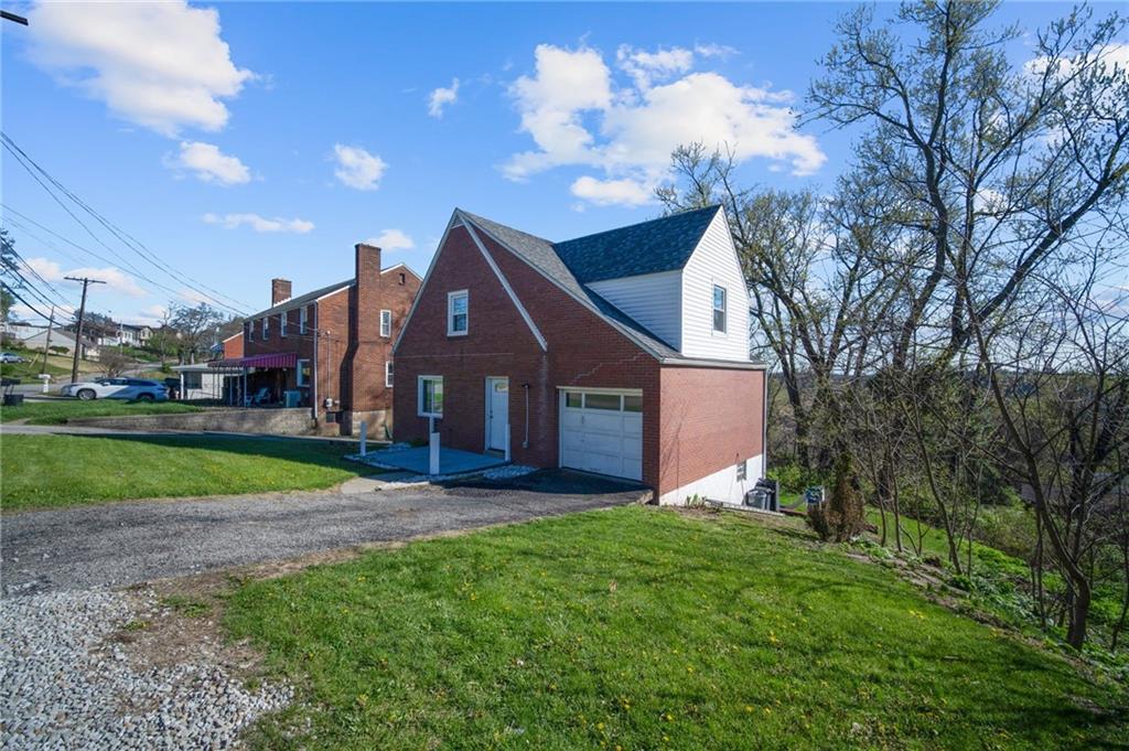 4030 Lebanon Church Road West Mifflin, PA 15122 - Photo 37 of 45 a view of a house with a yard