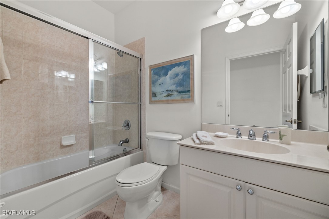 16253 Coco Hammock Way, Unit 201 Fort Myers, FL 33908 - Photo 17 of 34 a bathroom with a sink a toilet and shower
