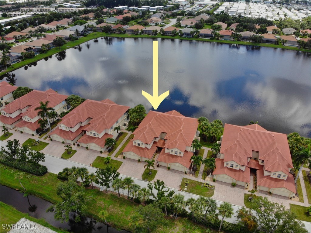 16253 Coco Hammock Way, Unit 201 Fort Myers, FL 33908 - Photo 27 of 34 an aerial view of a house with a lake view
