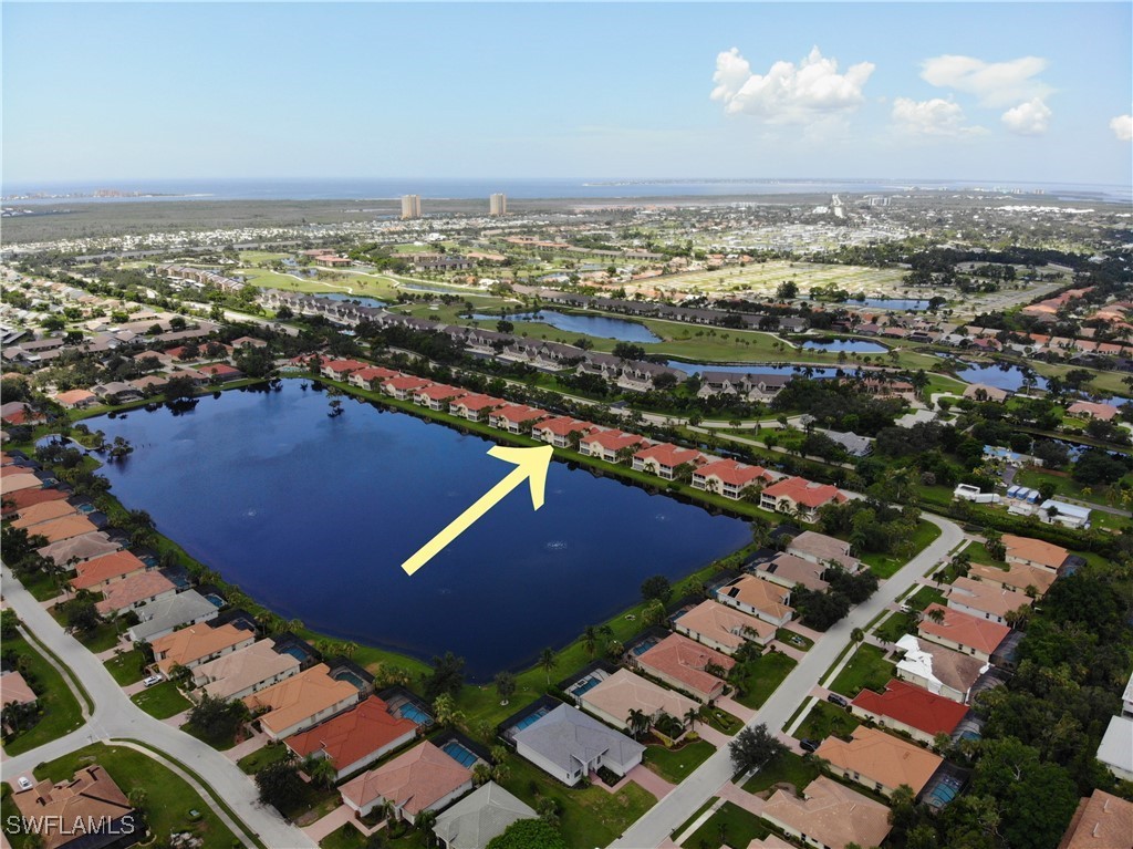 16253 Coco Hammock Way, Unit 201 Fort Myers, FL 33908 - Photo 28 of 34 an aerial view of residential houses with outdoor space