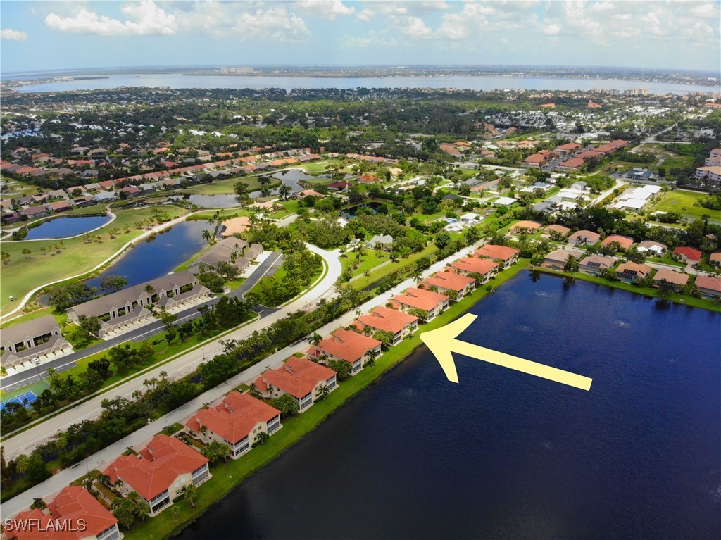 16253 Coco Hammock Way, Unit 201 Fort Myers, FL 33908 - Photo 31 of 34 an aerial view of residential houses with outdoor space