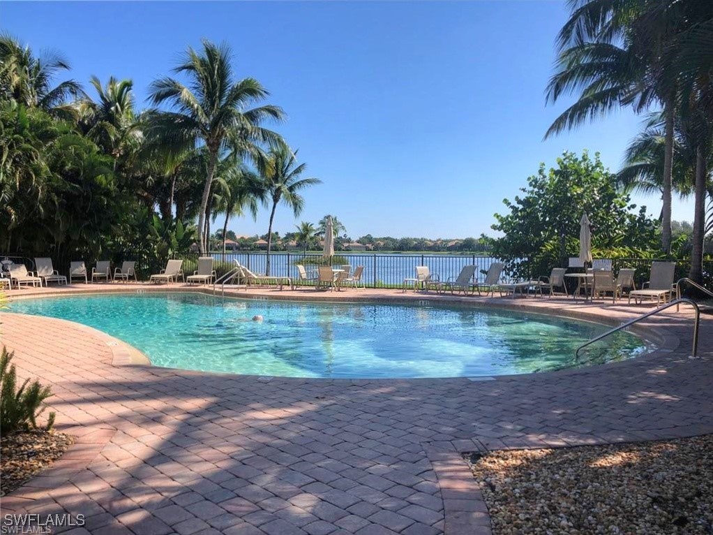 16253 Coco Hammock Way, Unit 201 Fort Myers, FL 33908 - Photo 32 of 34 a view of a yard with a slide