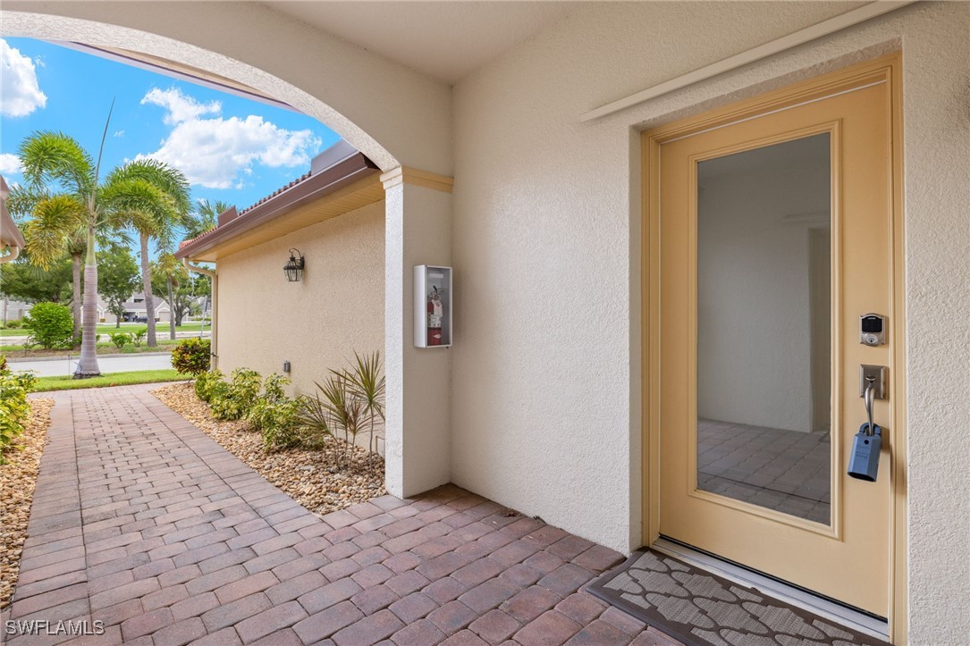 16253 Coco Hammock Way, Unit 201 Fort Myers, FL 33908 - Photo 6 of 34 a view of backyard with workspace
