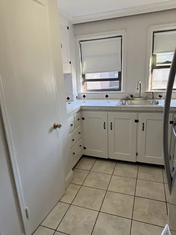 a bathroom with a sink vanity and mirror