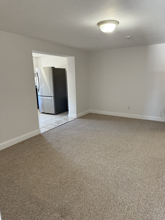 15 Weston Court, Unit 4 Braintree, MA 02184 - Photo 4 of 6 a view of an empty room with closet and bathroom