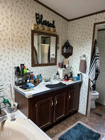 a kitchen with a sink stove and microwave