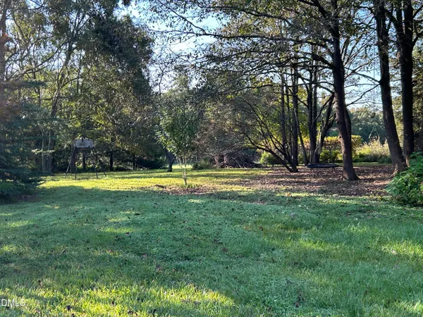 a view of a swimming pool with a yard