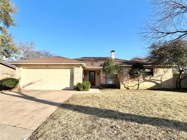 a view of a house with a snow in the yard