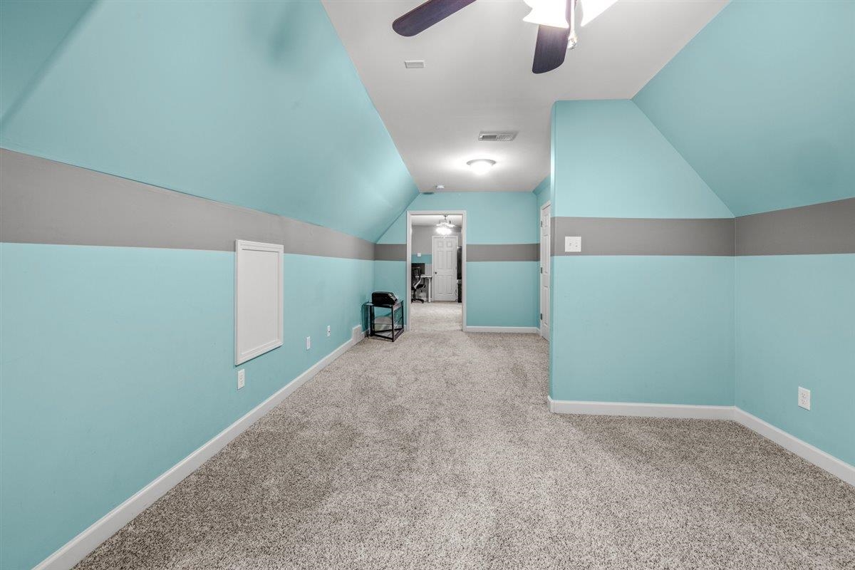 744 Southern Home Road Collierville, TN 38017 - Photo 15 of 24 Carpeted room featuring sloped ceilings with recessed lighting, a ceiling fan, light blue and gray painted walls, and white trim