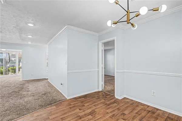 a view of a big room with closet and windows