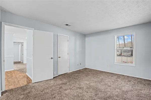 a view of an empty room and window