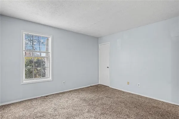 a view of a room that has a window in it
