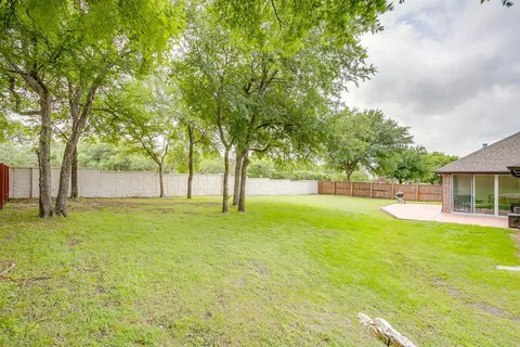 a view of swimming pool with tree s