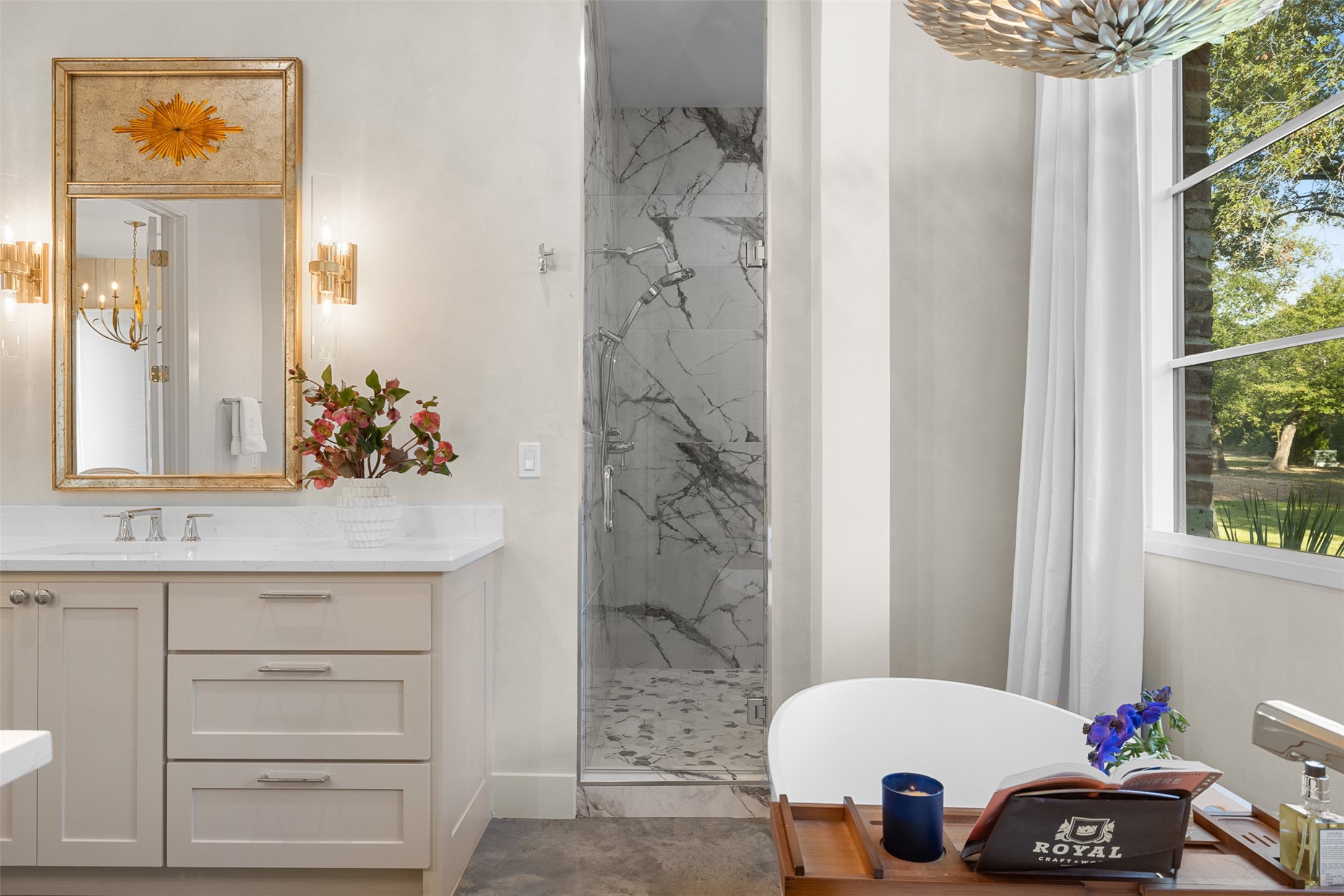 565 Bybee Road Round Top, TX 78954 - Photo 12 of 30 a bathroom with a sink and a mirror