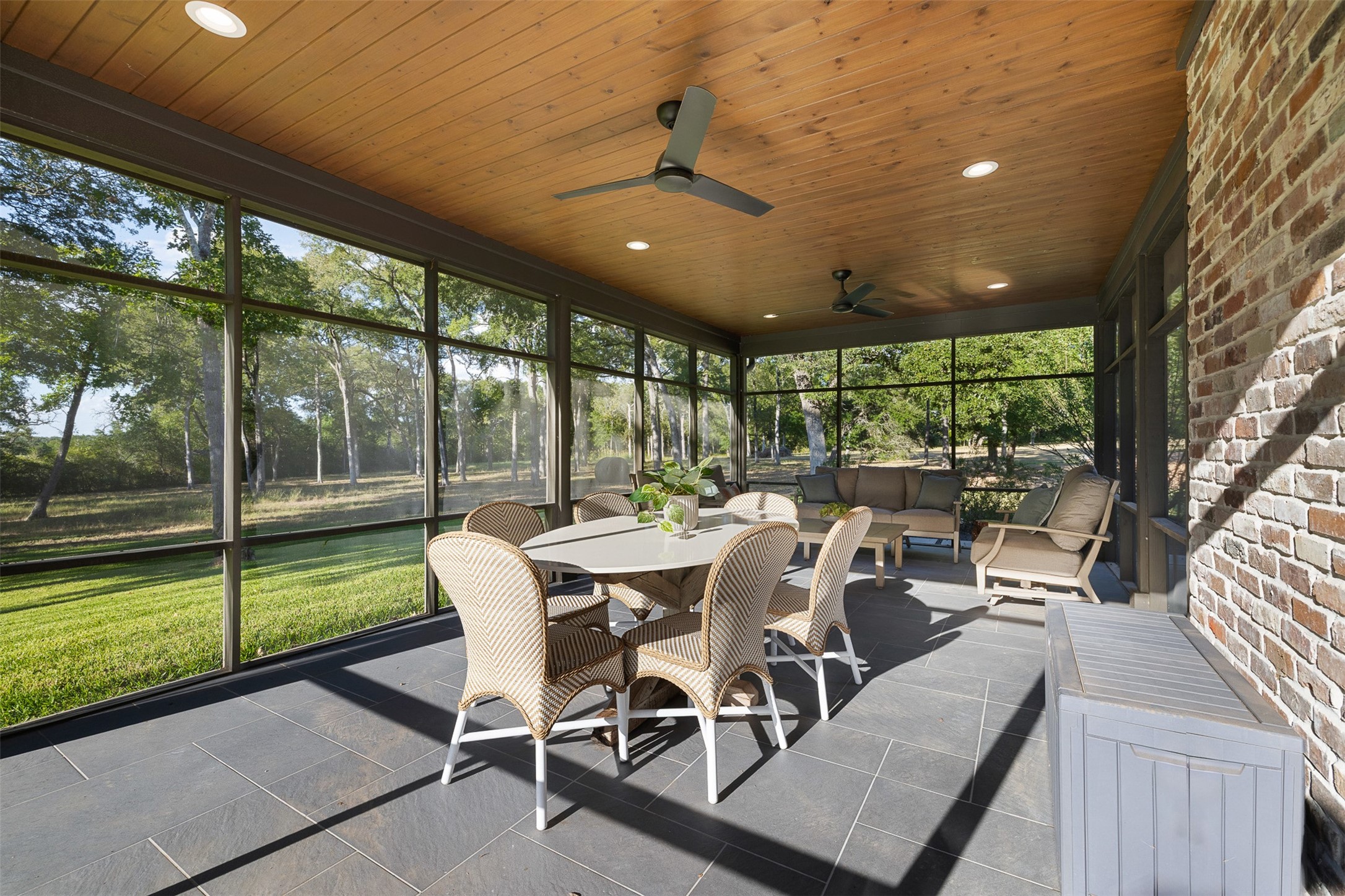 565 Bybee Road Round Top, TX 78954 - Photo 21 of 32 a view of a dining room with furniture wooden floor and a potted plant