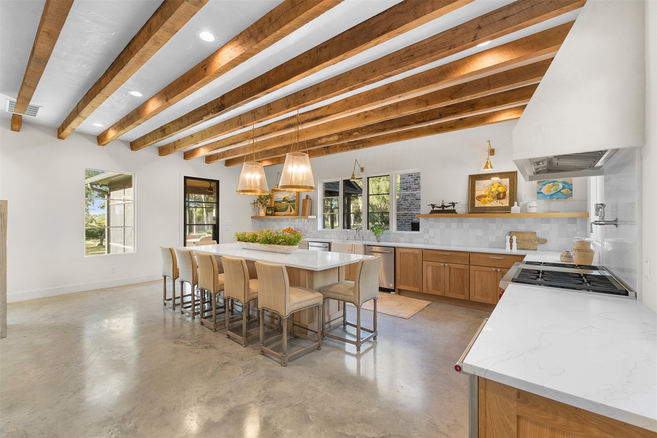565 Bybee Road Round Top, TX 78954 - Photo 3 of 30 a view of a dining room with furniture and wooden floor