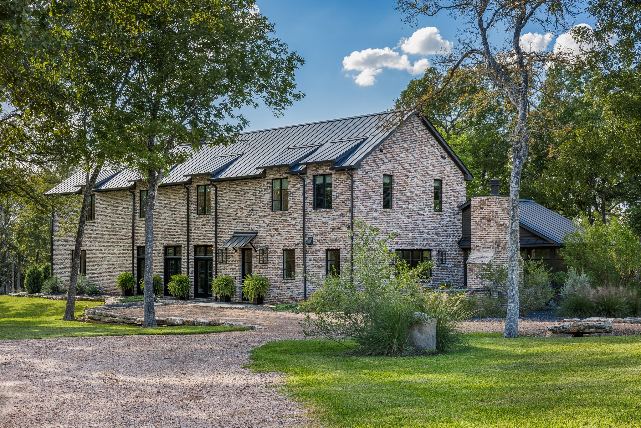 565 Bybee Road Round Top, TX 78954 - Photo 32 of 32 a front view of a house with a yard