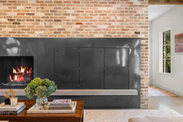 a view of fireplace and potted plants
