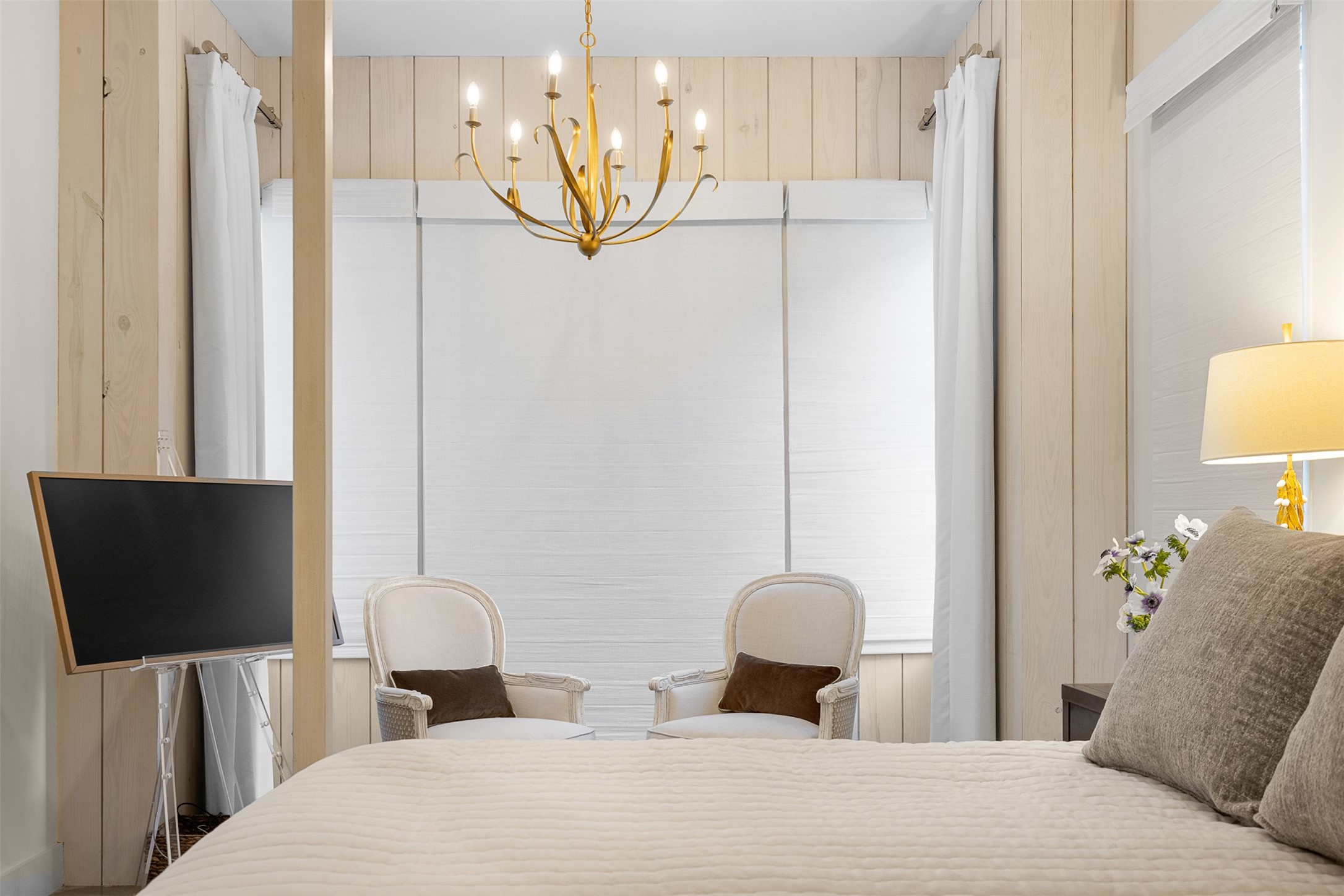 565 Bybee Road Round Top, TX 78954 - Photo 10 of 30 a bedroom with a bed and a television