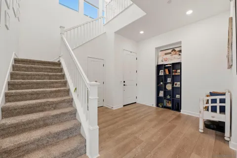 a bathroom with a granite countertop sink mirror and cabinets