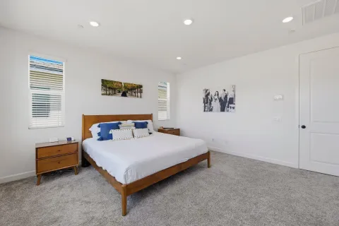 a living room with furniture a rug and a book shelf
