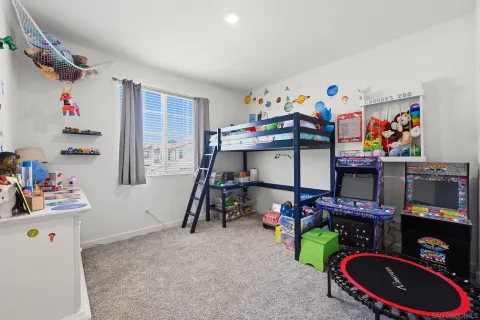 an aerial view of residential houses with outdoor space and river
