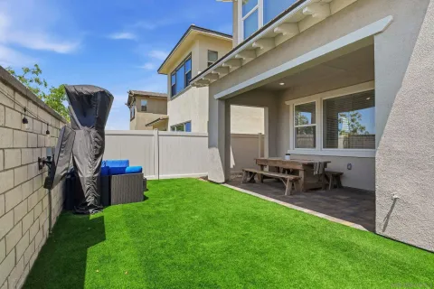 an aerial view of a house with a garden and yard