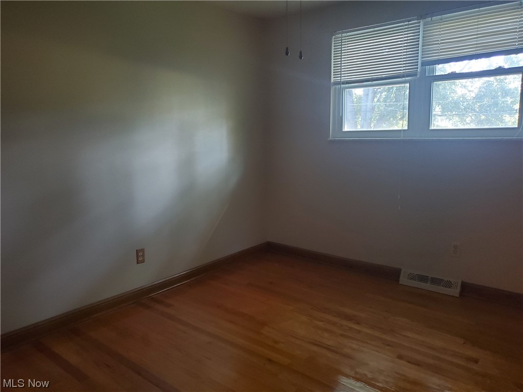 12221 Reno Drive Parma, OH 44130 - Photo 27 of 29 Spare room featuring dark hardwood flooring