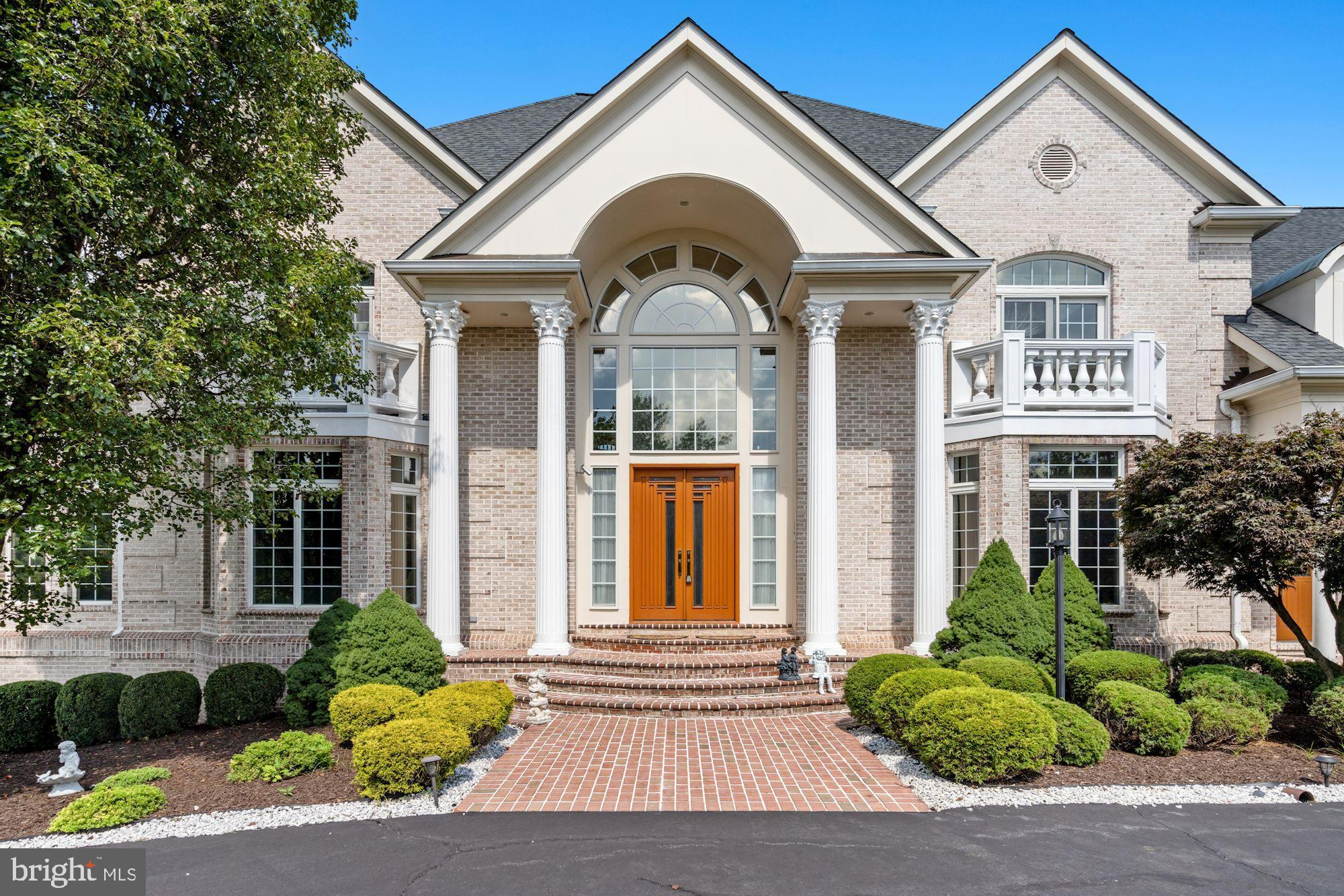 12705 Greenbriar Road Potomac, MD 20854 - Photo 7 of 94 Decorative Corinthian columns accent the front