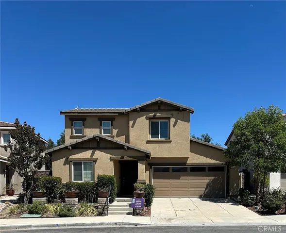a front view of a house with garage