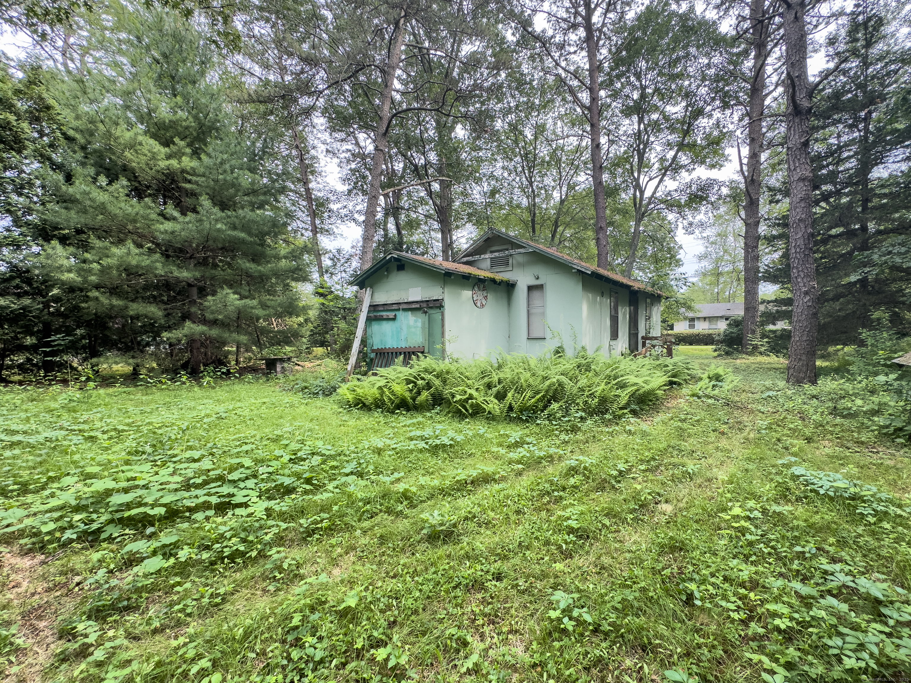 28 Pleasant View Street Lisbon, CT 06351 - Photo 3 of 8 a yellow house in middle of the forest