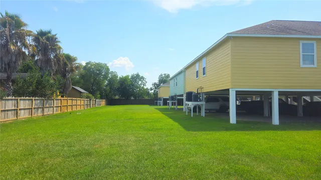 a view of house with backyard