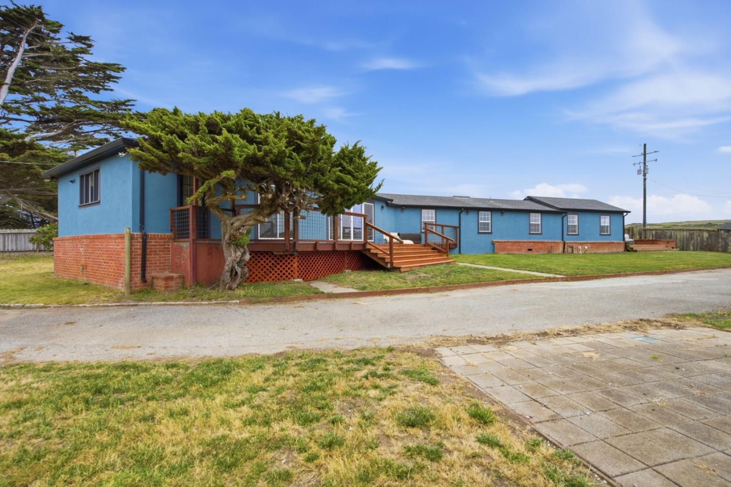 1263 Reservoir Road Pescadero, CA 94060 - Photo 7 of 66 a view of large house with a big yard and palm trees
