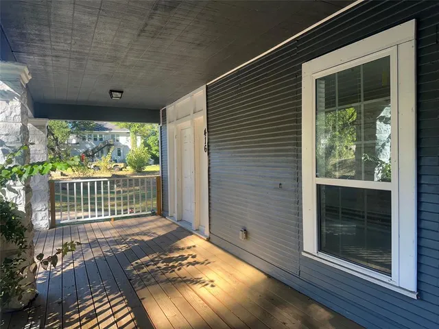 a view of entryway with wooden floor