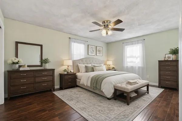 a bedroom with a bed and a dresser