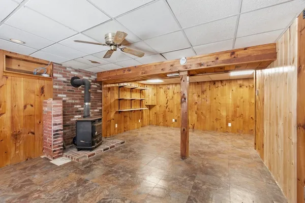 a view of empty room with wooden walls