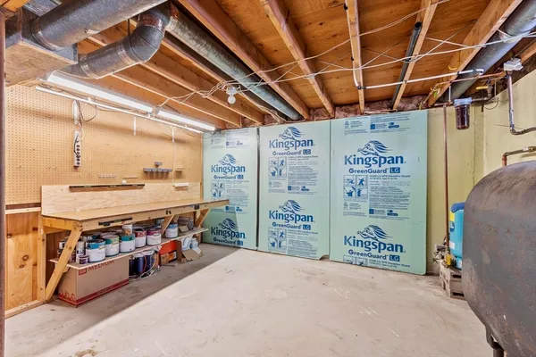 a front view of a house with a yard covered in snow