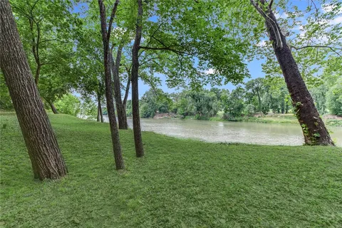 a view of lake with green space