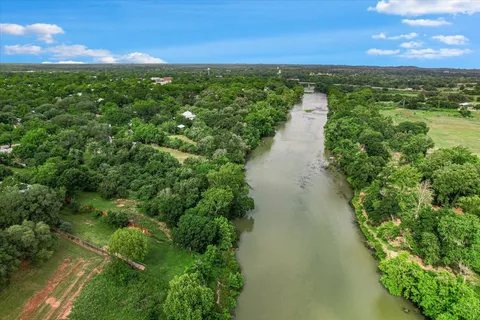 a view of a lake with a yard
