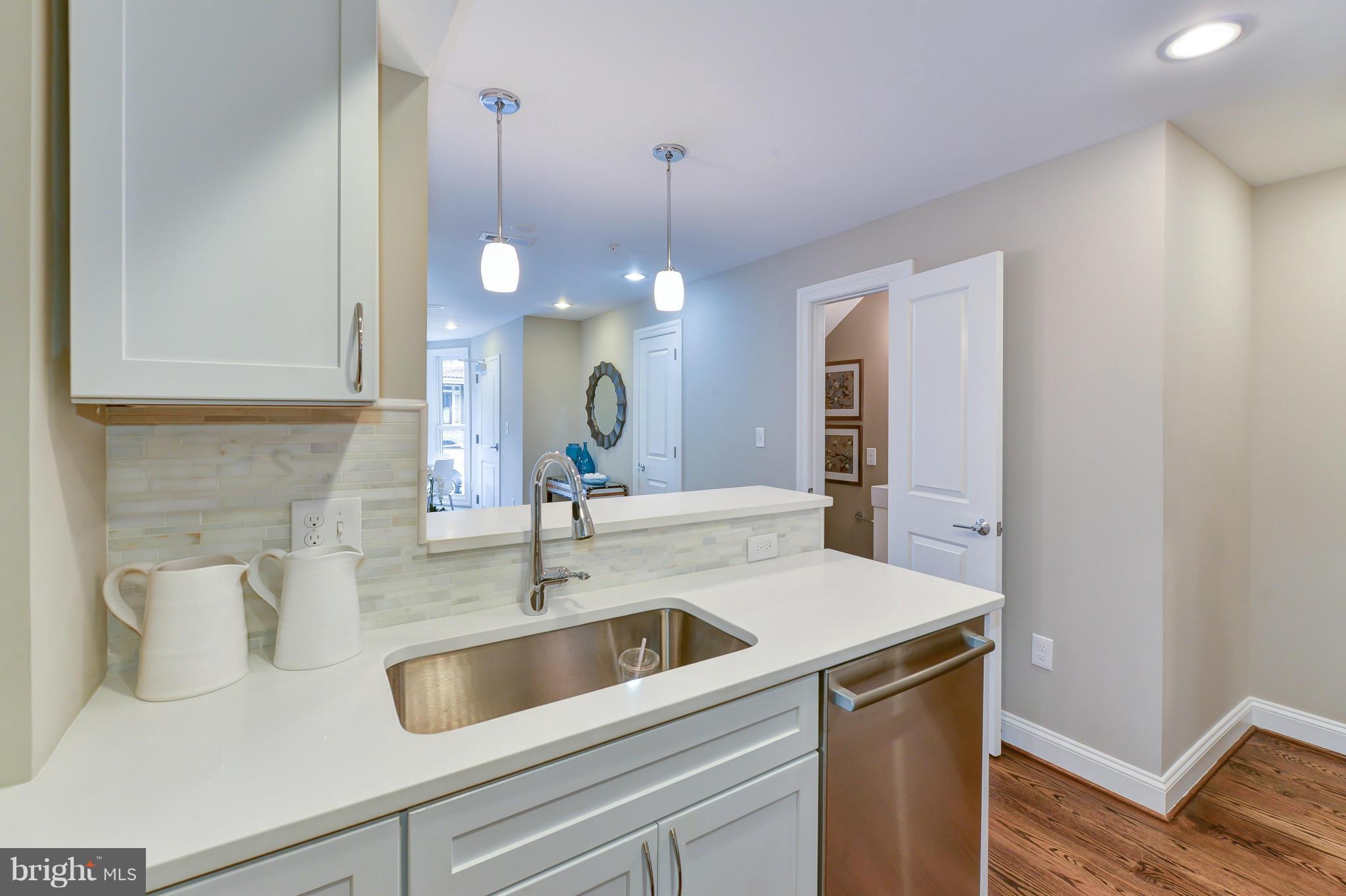 1823 S Street Northwest, Unit 3 Washington, DC 20009 - Photo 11 of 24 a kitchen with a sink and cabinets