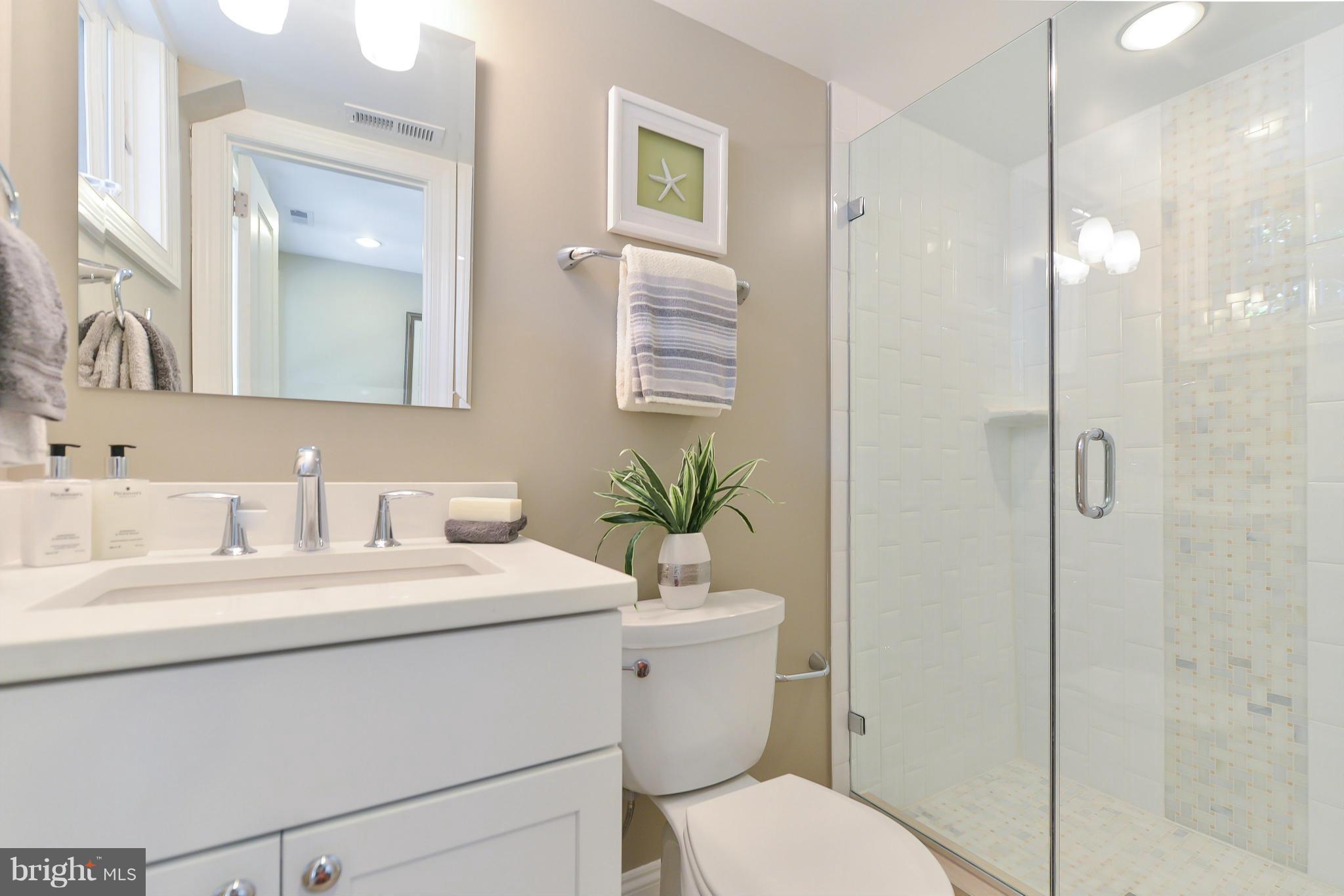 1823 S Street Northwest, Unit 3 Washington, DC 20009 - Photo 21 of 24 a bathroom with a sink toilet and shower