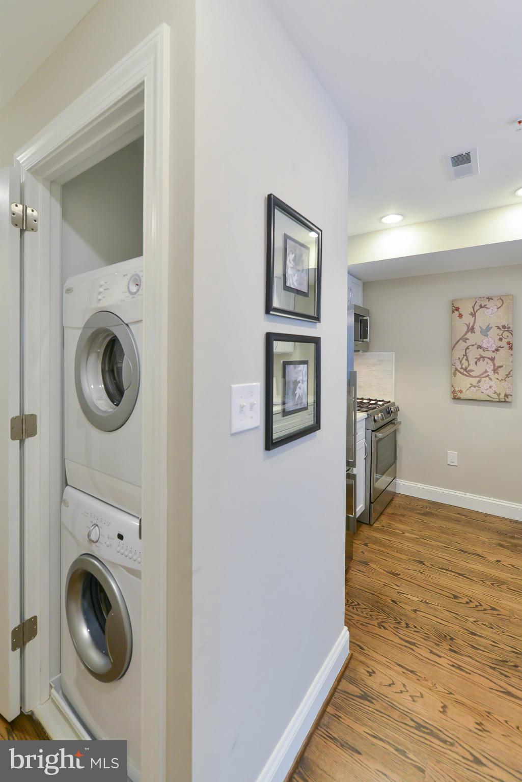 1823 S Street Northwest, Unit 3 Washington, DC 20009 - Photo 23 of 24 a view of a hallway with washer and dryer
