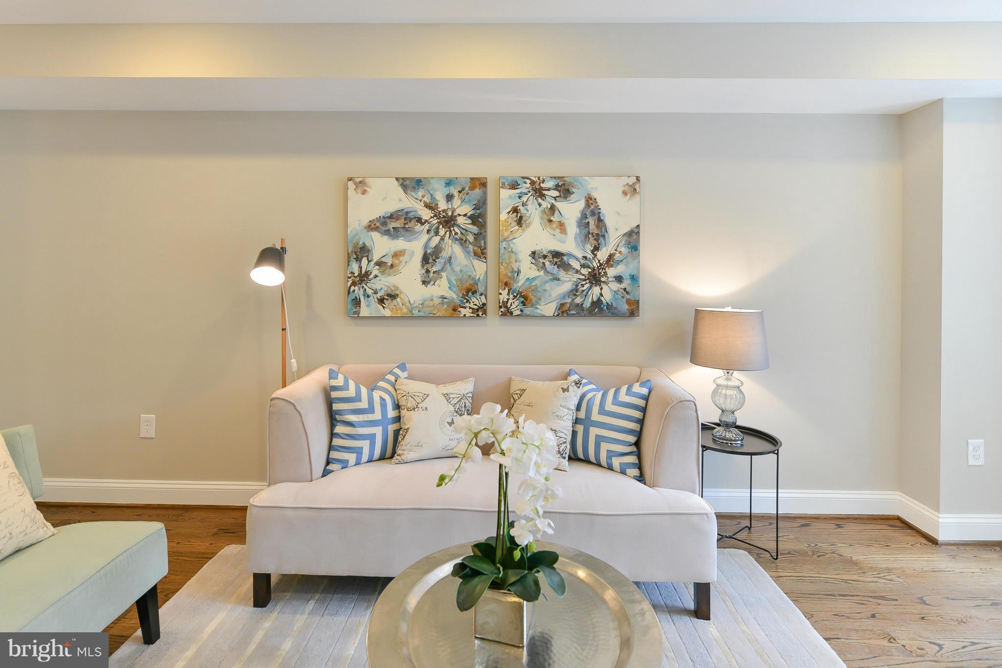 1823 S Street Northwest, Unit 3 Washington, DC 20009 - Photo 4 of 24 a living room with furniture and a lamp