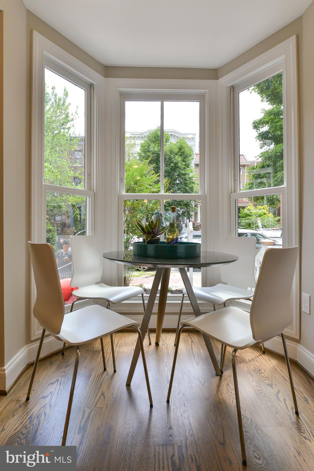 1823 S Street Northwest, Unit 3 Washington, DC 20009 - Photo 6 of 24 a workspace with furniture window and wooden floor