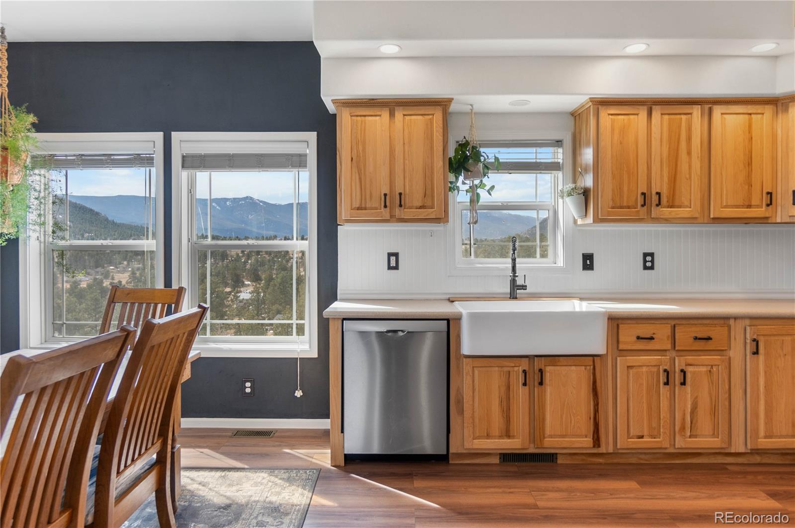 147 Overlook Drive Bailey, CO 80421 - Photo 11 of 43 a kitchen with a sink cabinets and a large window