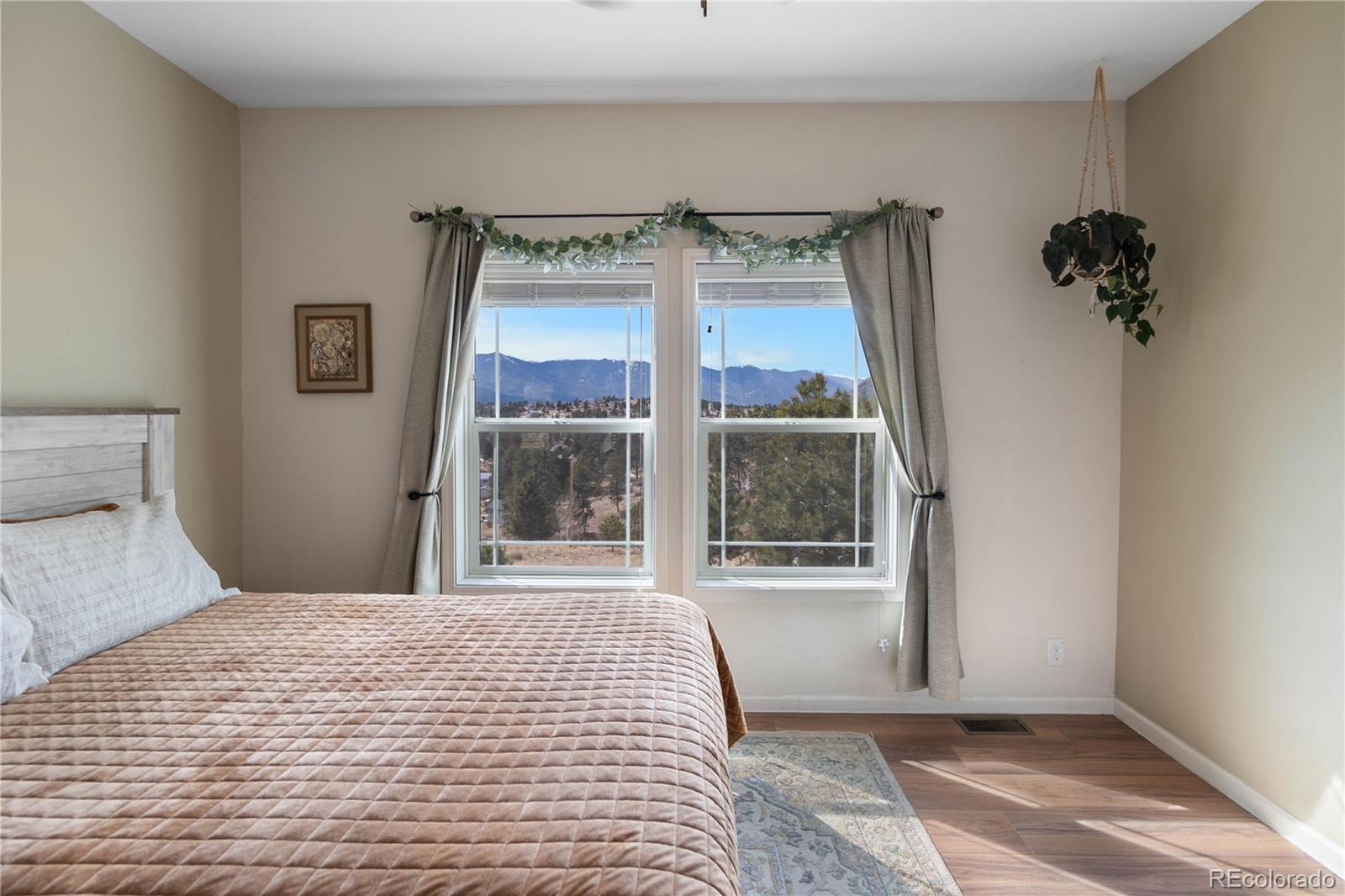 147 Overlook Drive Bailey, CO 80421 - Photo 16 of 43 a bedroom with a bed and a window
