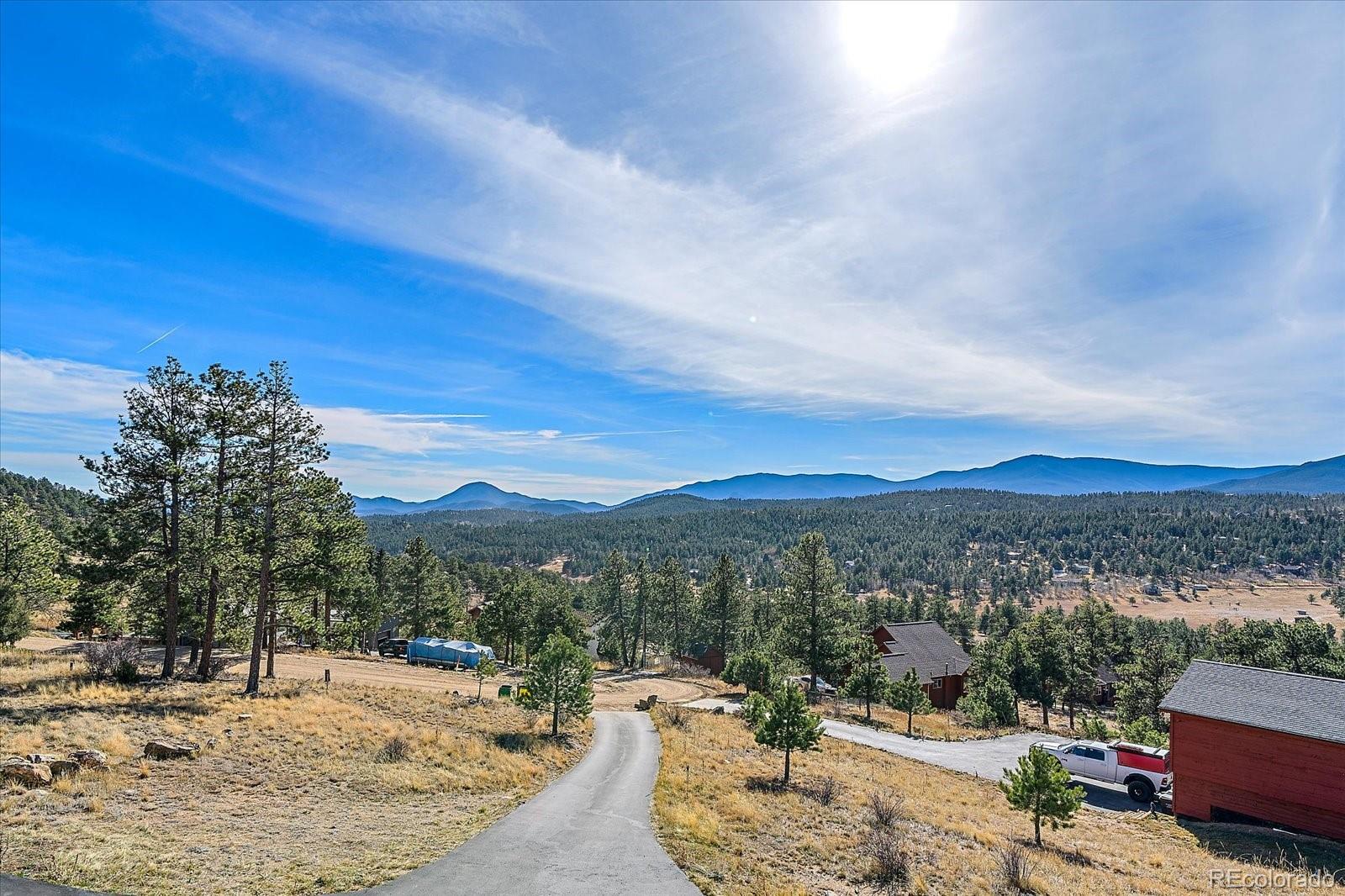 147 Overlook Drive Bailey, CO 80421 - Photo 2 of 43 a view of a town with mountains in the background