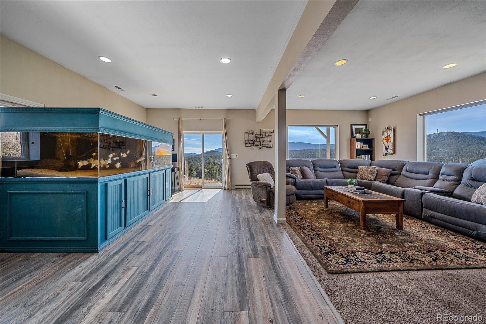 147 Overlook Drive Bailey, CO 80421 - Photo 24 of 43 a living room with furniture and a wooden floor