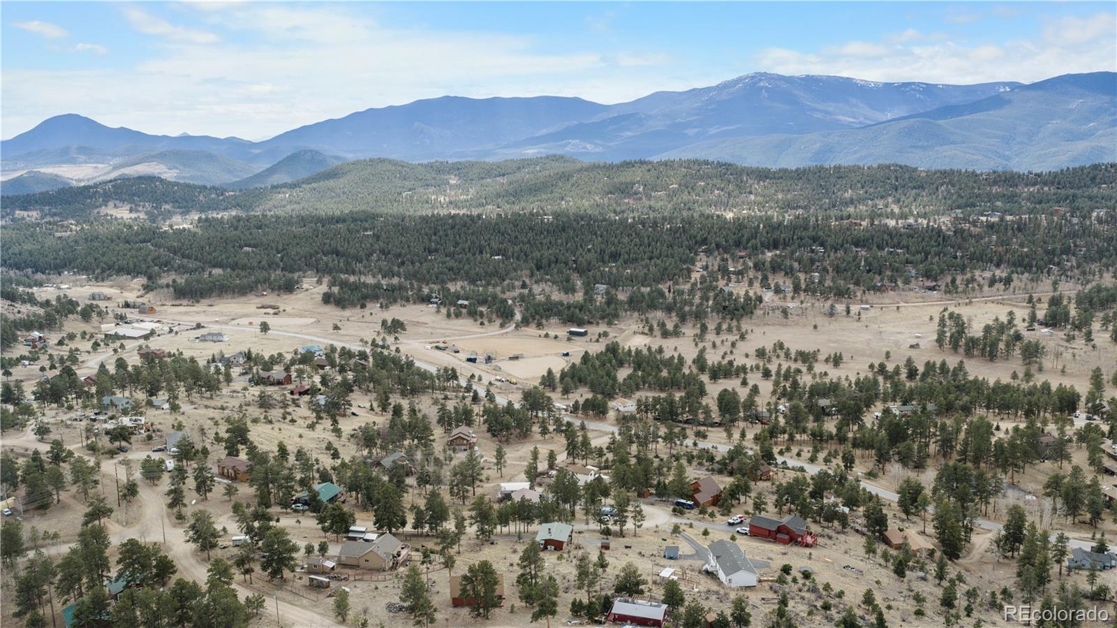 147 Overlook Drive Bailey, CO 80421 - Photo 40 of 43 a view of a town with mountains in the background