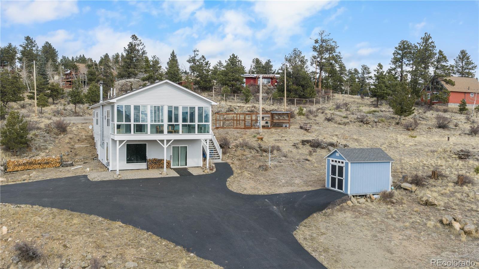 147 Overlook Drive Bailey, CO 80421 - Photo 4 of 43 a view of a house with a yard
